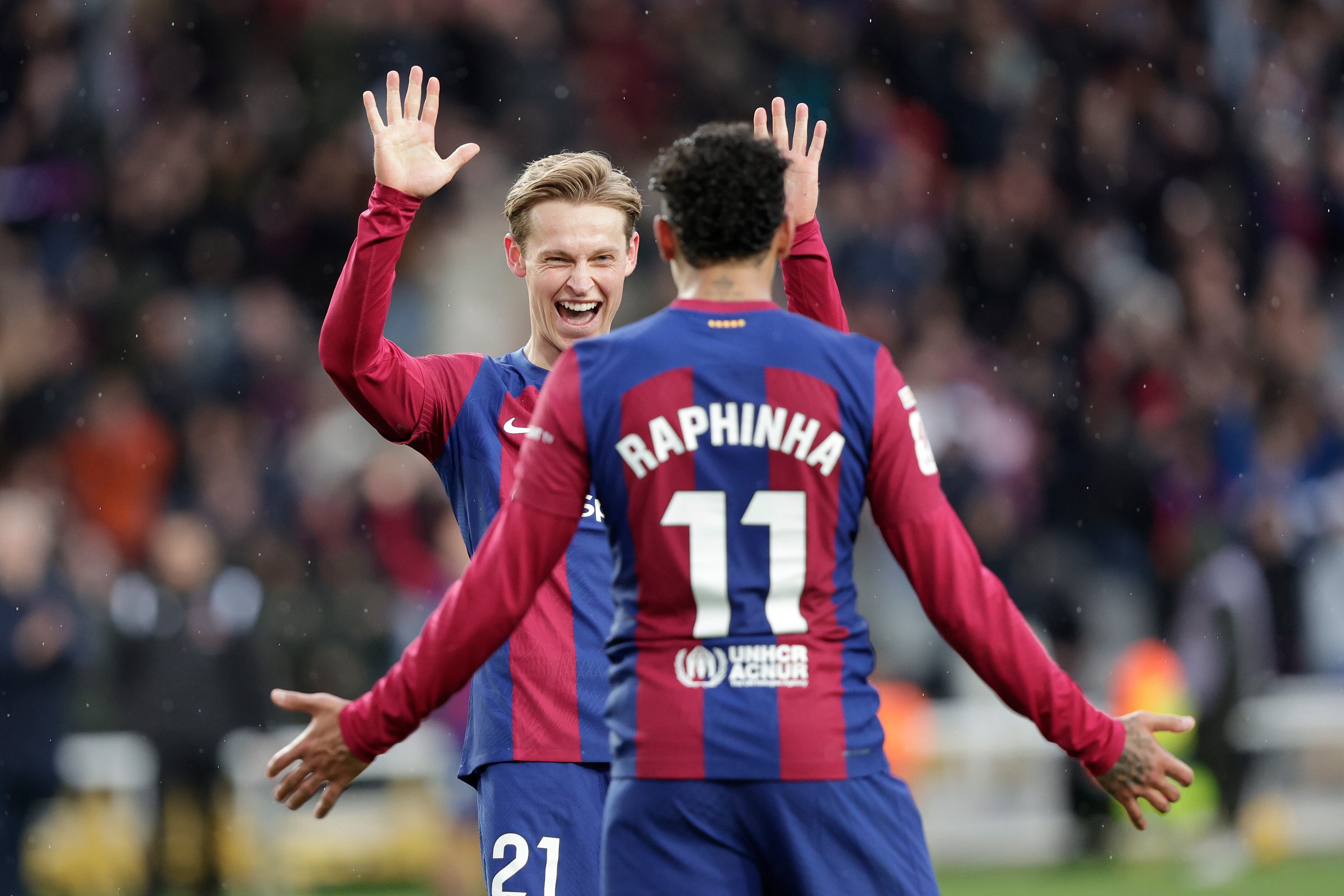 BARCELONA, SPAIN - FEBRUARY 24: Frenkie de Jong of FC Barcelona celebrates the 3-0 with Raphinha of FC Barcelona during the LaLiga EA Sports  match between FC Barcelona v Getafe at the Lluis Companys Olympic Stadium on February 24, 2024 in Barcelona Spain (Photo by David S Bustamante/Soccrates/Getty Images)