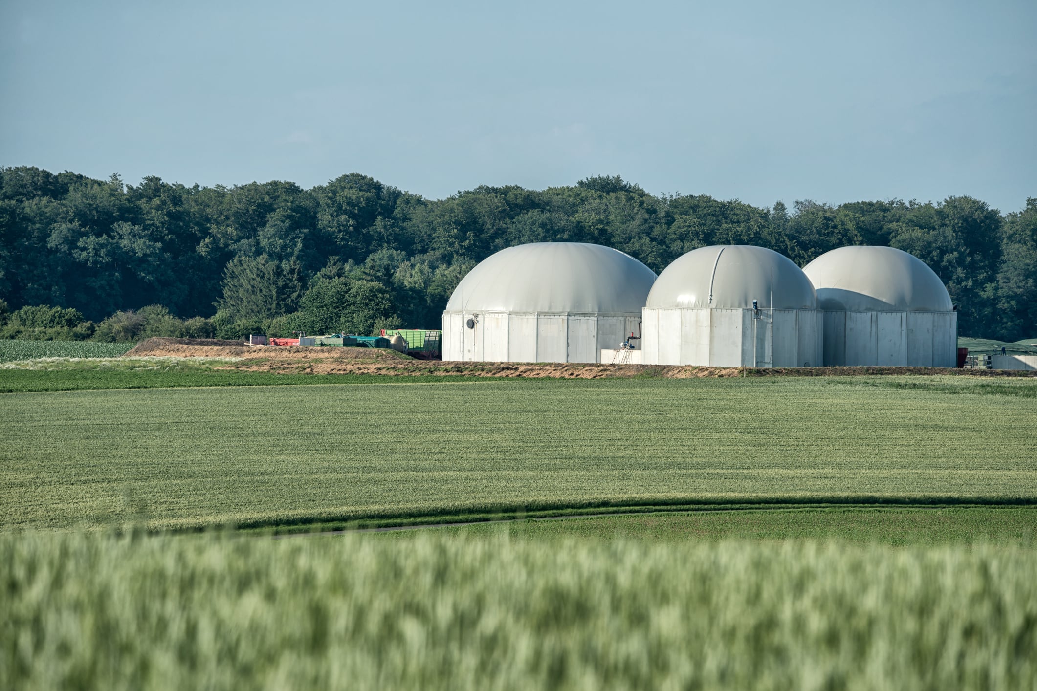 Biomass energy plant in a rural landscape on a hot summer day . 