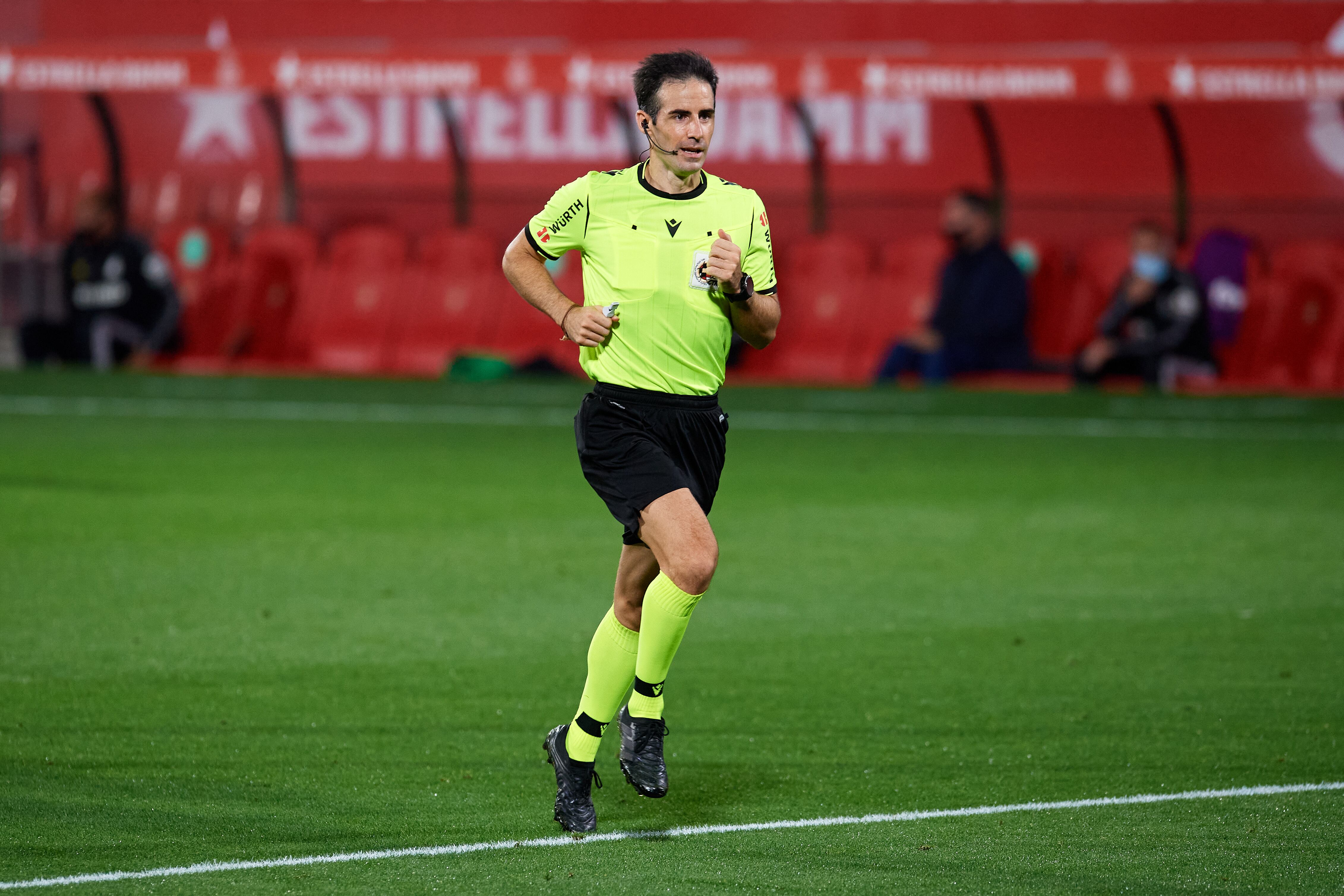 GIRONA, SPAIN - NOVEMBER 14: Referee Jon Ander Gonzalez Esteban runs during the LaLiga Smartbank match between Girona FC and RCD Mallorca at Montilivi Stadium on November 14, 2020 in Girona, Spain. Sporting stadiums around Spain remain under strict restrictions due to the Coronavirus Pandemic as Government social distancing laws prohibit fans inside venues resulting in games being played behind closed doors. (Photo by Alex Caparros/Getty Images)