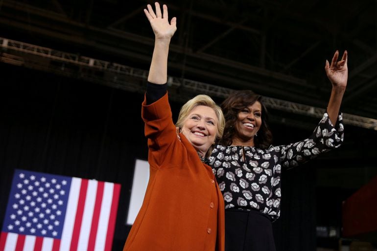 U S Democratic presidential candidate Hillary Clinton arrives to a campaign rally accompanied by U S first lady Michelle Obama in Winston-Salem, North Carolina