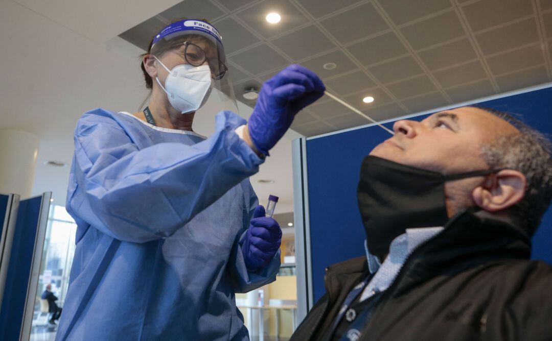 A Journalist is tested with a PCR test for COVID-19