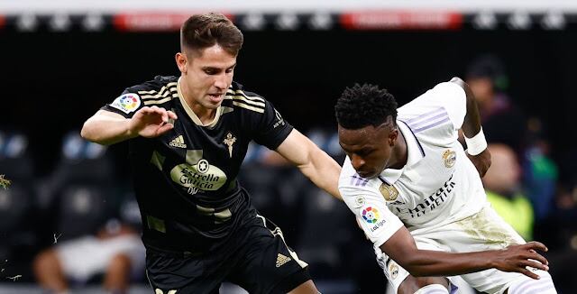 MADRID, SPAIN - APRIL 22: Fernando Medrano of RC Celta de Vigo and Vinicius Junior of Real Madrid in action during the spanish league, La Liga Santander, football match played between Real Madrid and RC Celta de Vigo at Santiago Bernabeu stadium on April 22, 2023, in Madrid, Spain. (Photo By Oscar J. Barroso/Europa Press via Getty Images)