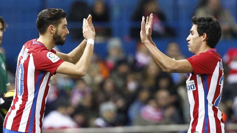 Gaitán y Carrasco durante un partido con el Atlético 