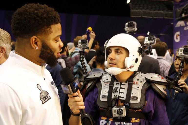 Jan 27, 2015; Phoenix, AZ, USA; Seattle Seahawks quarterback B.J. Daniels (left) is interviewed by NBC Sports correspondent Karim Mendiburu Contreras (right) during media day for Super Bowl XLIX at US Airways Center. Mandatory Credit: Matthew Emmons-USA T