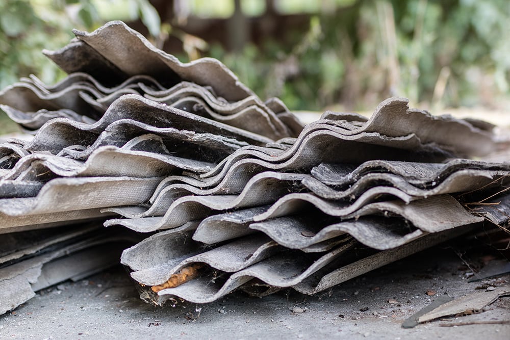 Eternit in an old farm in central europe. Old building materials used for roofing. Season of the summer.