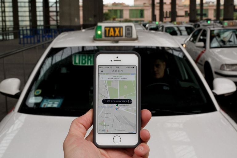 MADRID, SPAIN - OCTOBER 14:  In this photo illustration the new smart phone taxi app &#039;Uber&#039; shows how to select a pick up location at Atocha Station on October 14, 2014 in Madrid, Spain. &#039;Uber&#039; application started to operate in Madrid last September despi