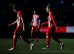 Soccer Football - La Liga Santander - Malaga CF vs Atletico Madrid - La Rosaleda, Malaga, Spain - February 10, 2018 Atletico Madrid&#039;s Filipe Luis and Antoine Griezmann REUTERS/Jon Nazca