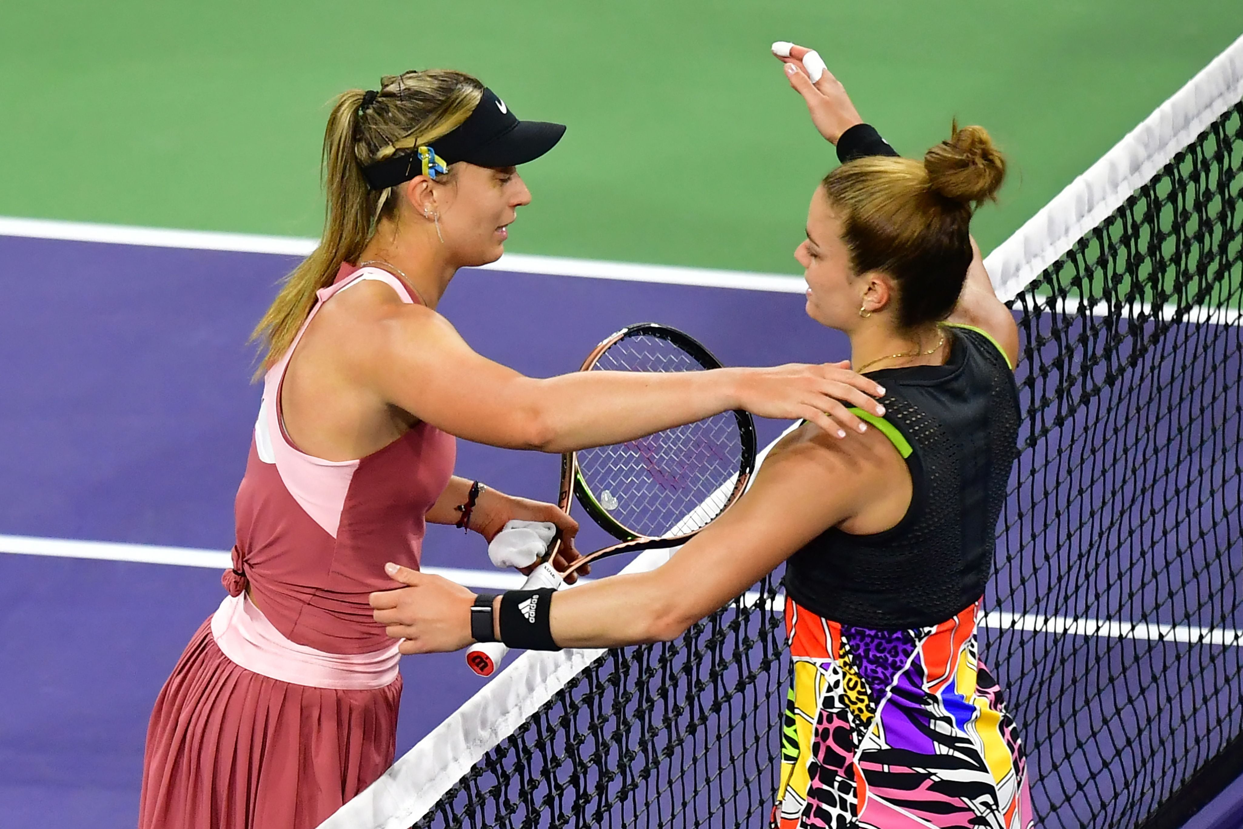 Maria Sakkari (R) of Greece and Paula Badosa of Spain meet at the net following their WTA semifinal match at the Indian Wells tennis tournament on March 18, 2022 in Indian Wells, California. - Sakkari defeated Badosa 6-2, 4-6, 6-1. (Photo by Frederic J. BROWN / AFP) (Photo by FREDERIC J. BROWN/AFP via Getty Images)