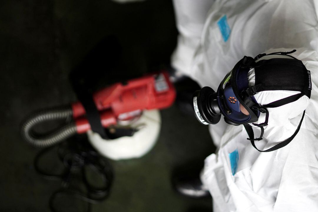 A member of the Thai Airways crew wearing a protective suit and mask is seen before disinfecting the cabin of an aircraft of the national carrier during a procedure to prevent the spread of the coronavirus at Bangkok's Suvarnabhumi International Airport, Thailand, January 28, 2020.