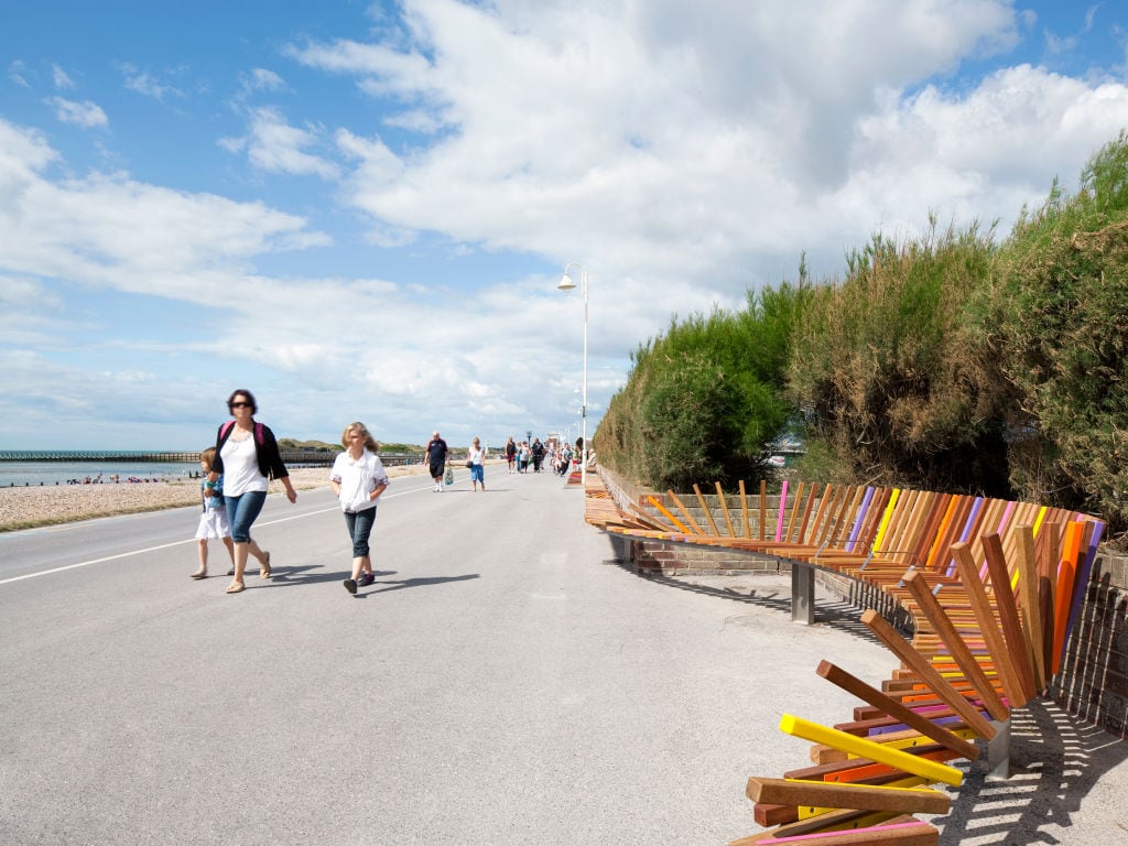 The Longest Bench, The Promenade Sea Road, Littlehampton, West Sussex, United Kingdom, Architect: Studio Weave, 2010, The Longest Bench Shelter With People Walking By Studio Weave 2010 U,K (Photo by View Pictures/Universal Images Group via Getty Images)