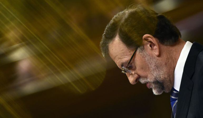 Spanish Prime Minister Mariano Rajoy speaks during a debate on the state of the nation at the Congress of Deputies (&quot;Las Cortes&quot;) building in Madrid on February 24, 2015. Although not in the Spanish constitution the debate has been established as a parlia