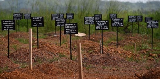 TOPSHOTS Tombstones are seen at a cemetery at the Kenama ebola treatment center run by the Red cross Society on November 15, 2014. Ebola-hit Sierra Leone faces social and economic disaster as gains made since the country&#039;s ruinous civil war are wiped out 