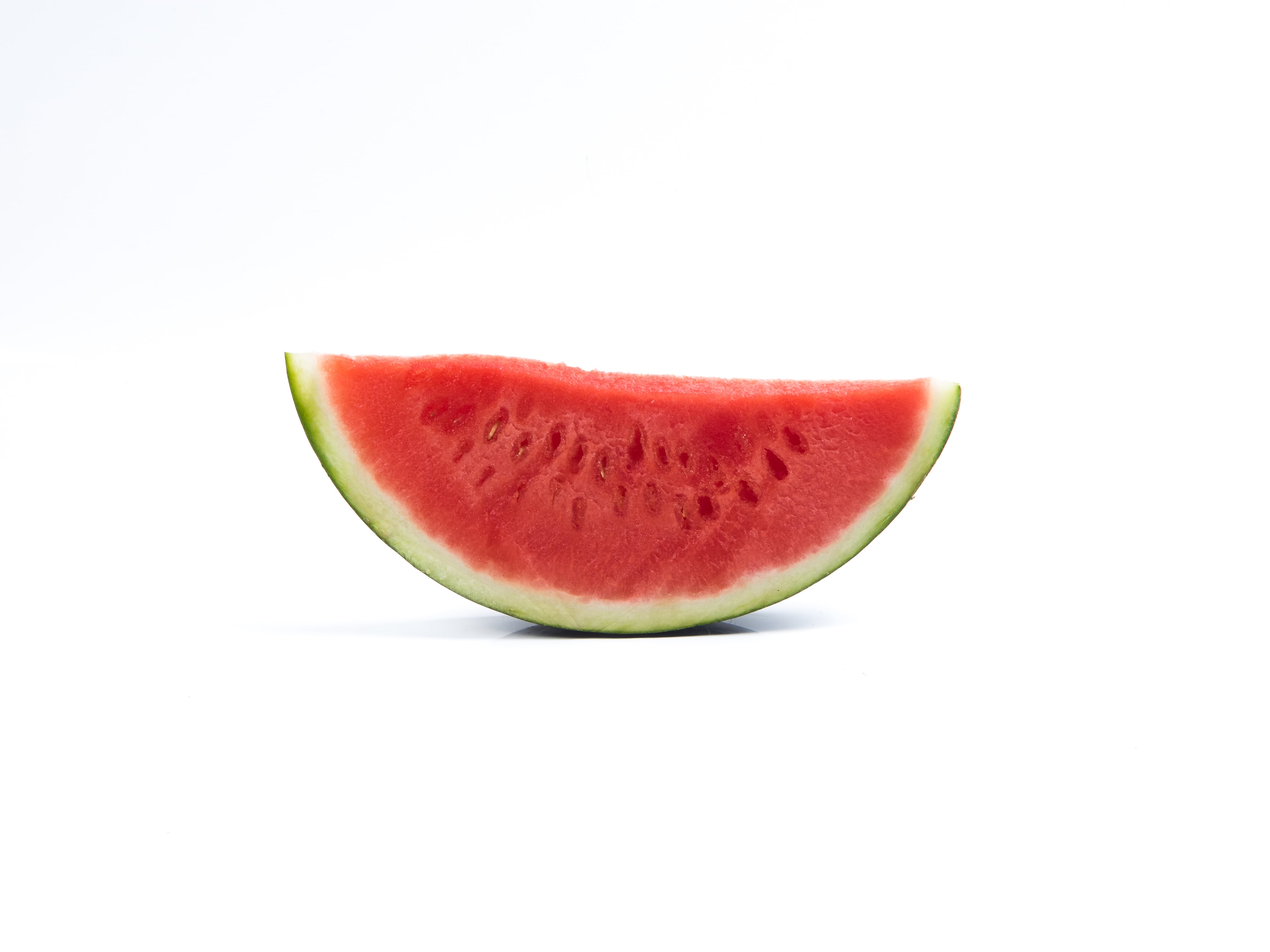 Watermelon slice on white background.