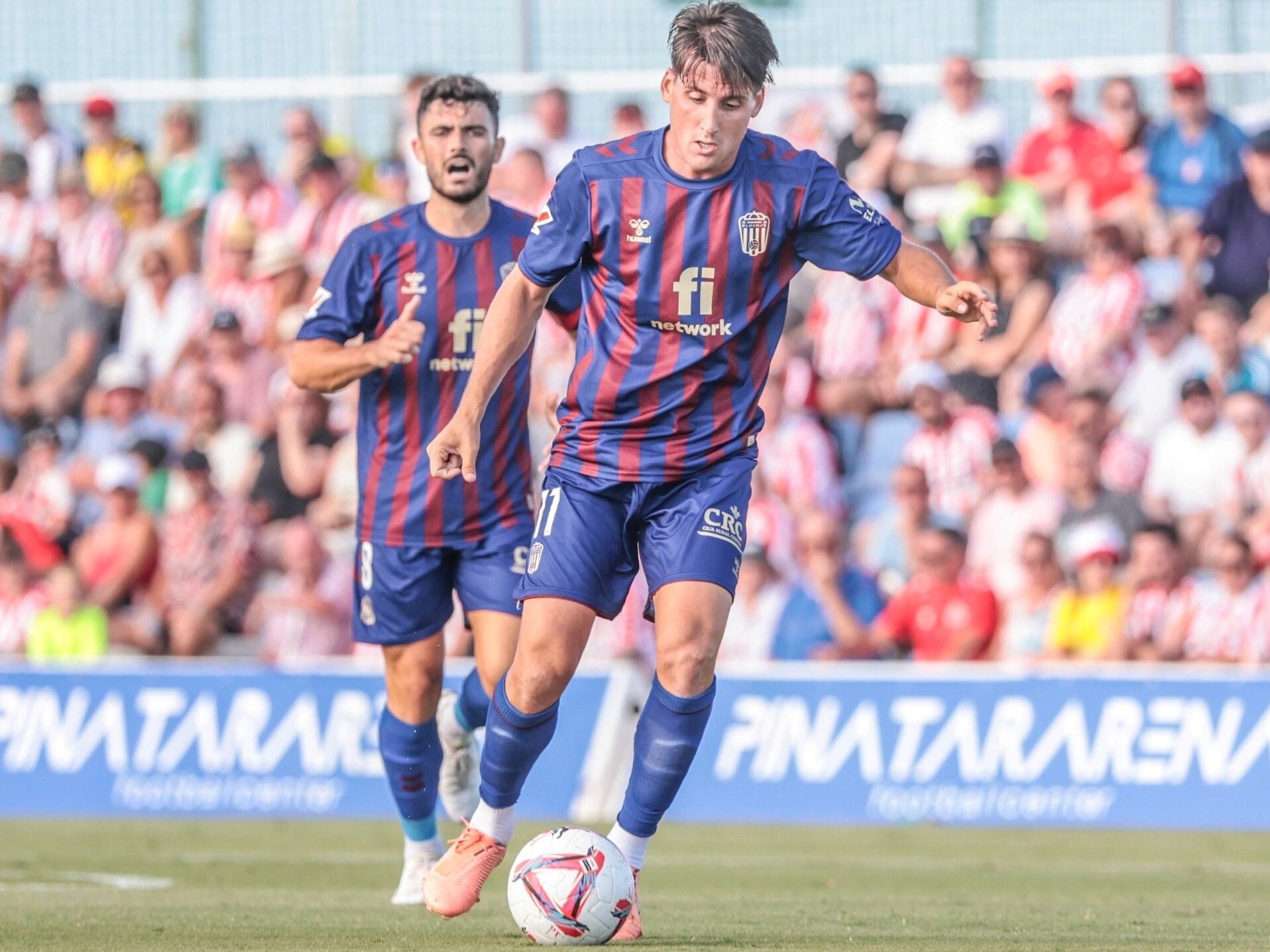 Juanto y Sergio Ortuño disputando la pretemporada.