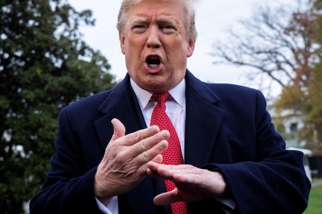 El presidente estadounidense, Donald Trump, conversa con los medios antes de viajar a Francia desde la Casa Blanca 