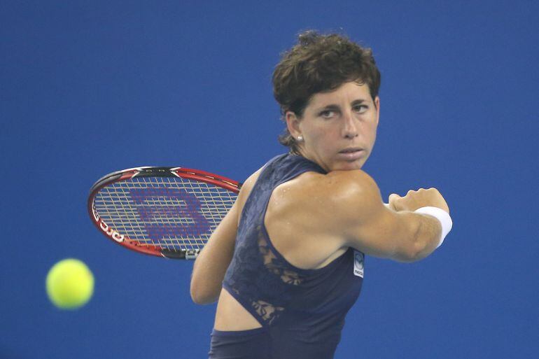 BEIJING, CHINA - OCTOBER 07: Carla Suarez Navarro of Spain returns a ball against Timea Bacsinszky of Switzerland during the day five of the 2015 China Open at the China National Tennis Center  on October 7, 2015 in Beijing, China.  (Photo by Emmanuel Wong/Getty Images)
