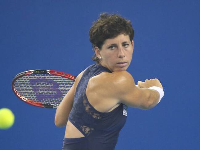 BEIJING, CHINA - OCTOBER 07: Carla Suarez Navarro of Spain returns a ball against Timea Bacsinszky of Switzerland during the day five of the 2015 China Open at the China National Tennis Center on October 7, 2015 in Beijing, China. (Photo by Emmanuel Wong/Getty Images)