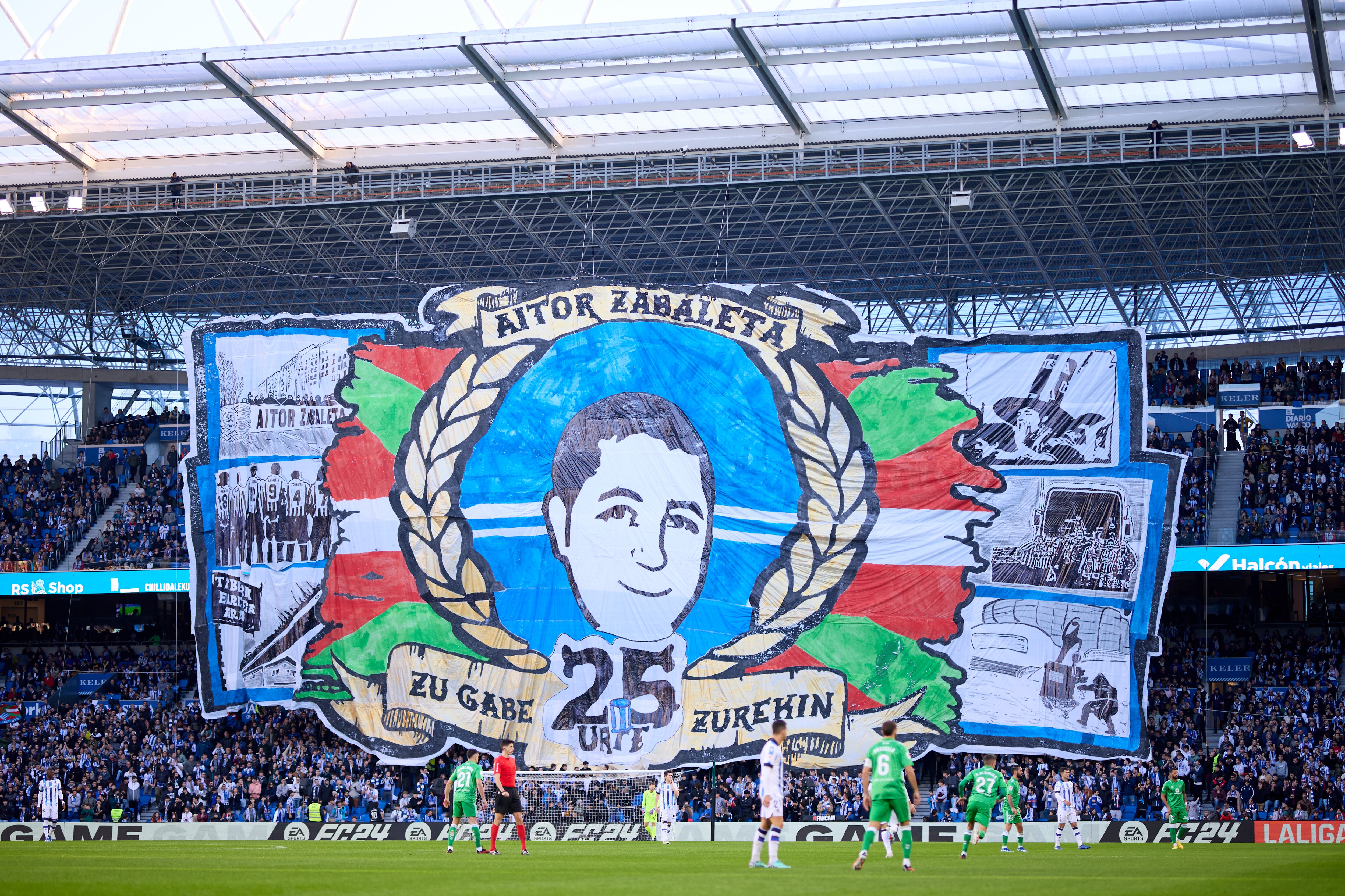 SAN SEBASTIAN, SPAIN - DECEMBER 17: Real Sociedad fans show a banner in memory of Aitor Zabaleta during the LaLiga EA Sports match between Real Sociedad and Real Betis at Reale Arena on December 17, 2023 in San Sebastian, Spain. (Photo by Ion Alcoba Beitia/Getty Images)