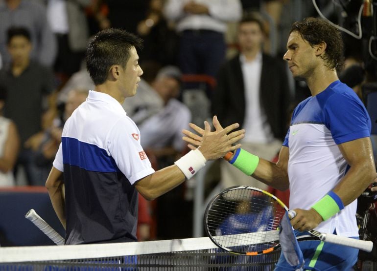 Aug 14, 2015; Montreal, Quebec, Canada; Kei Nishikori of Japan and Rafael Nadal of Spain shake hands after their match during the Rogers Cup tennis tournament at Uniprix Stadium. Mandatory Credit: Eric Bolte-USA TODAY Sports