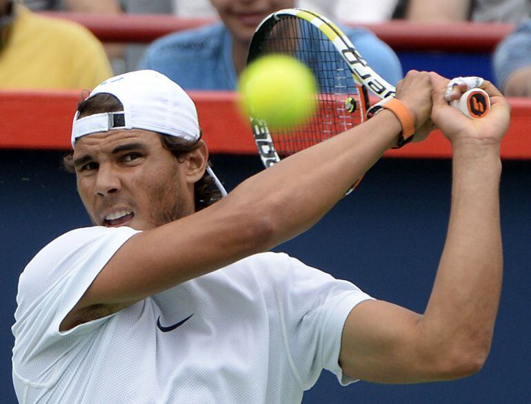 Aug 7, 2015; Montreal, Quebec, Canada; Rafael Nadal of Spain hits the ball during practice session at Uniprix Stadium. Mandatory Credit: Eric Bolte-USA TODAY Sports