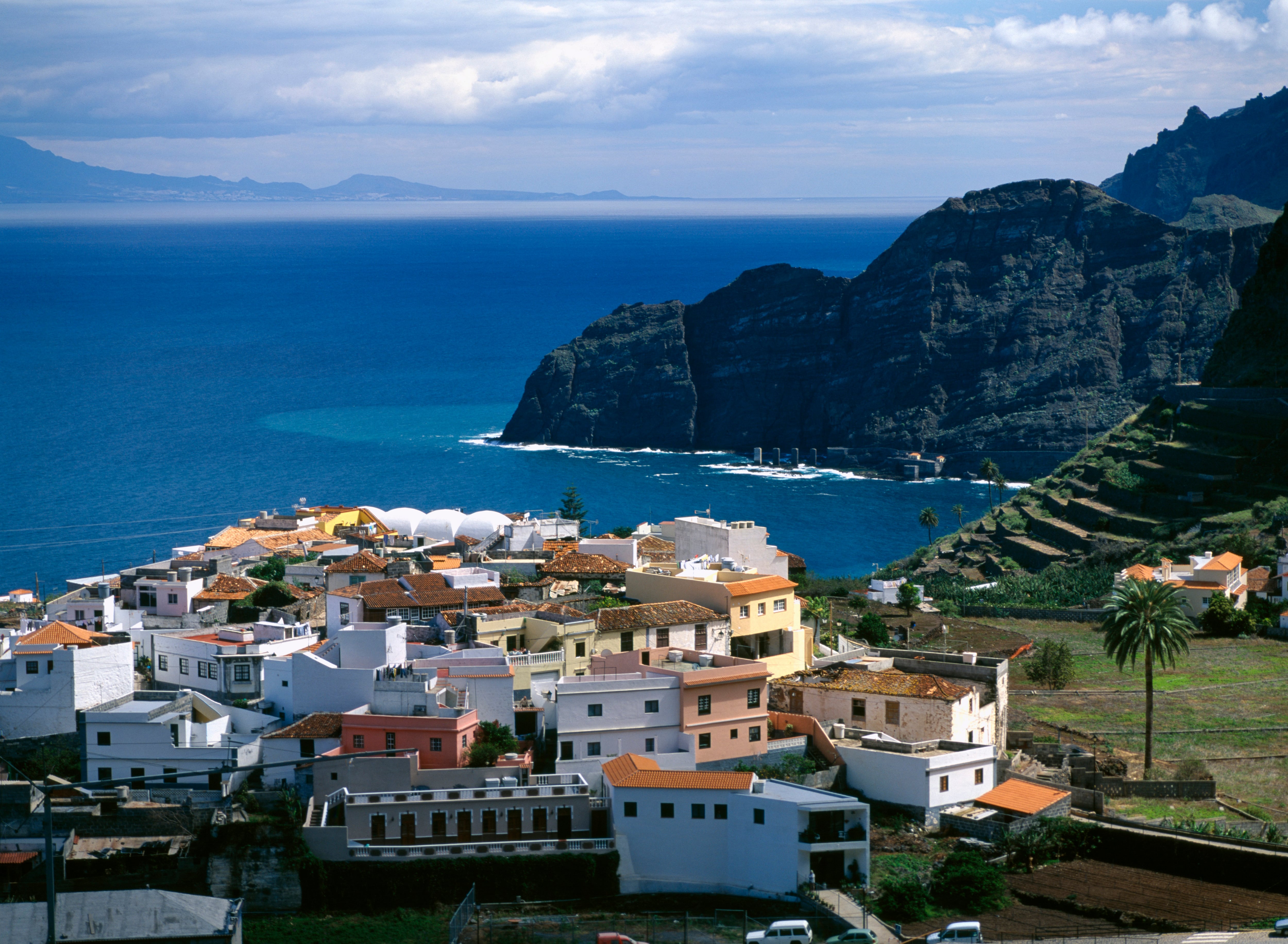 Agulo terraced hillside volcanic cliffs and sea beyond. (Photo by: Eye Ubiquitous/Universal Images Group via Getty Images)