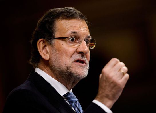 Spanish Prime Minister Mariano Rajoy gestures during a control session at the Spain&#039;s Lower House of the parliament in Madrid on November 27, 2014. Rajoy will present today a new law aimed at tightening political party accounting rules, the day after his 