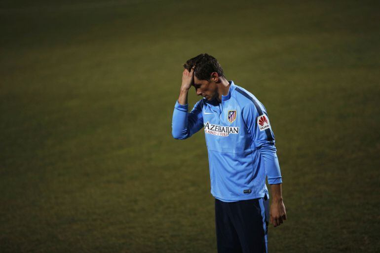 Spain forward Fernando Torres reacts while training at Atletico Madrid's sports grounds in Majadahonda, near Madrid, December 30, 2014. Torres is returning to his beloved hometown club Atletico Madrid "in pursuit of happiness", he said on Monday having ha
