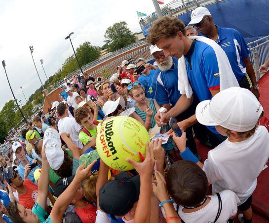 WINSTON SALEM, NC - AUGUST 27: Pablo Carreno Busta of Spain signs autographs for fans after his win over Roberto Bautista Agut of Spain in the men&#039;s singles championship final of the Winston-Salem Open at Wake Forest University on August 27, 2016 in Winst