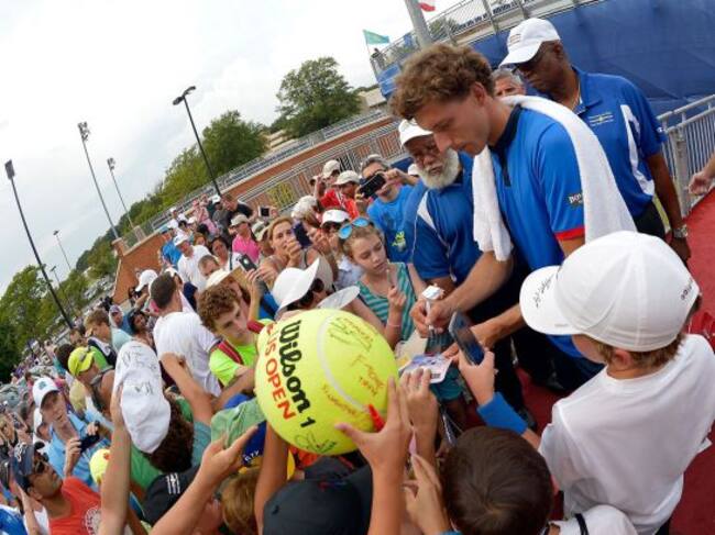 WINSTON SALEM, NC - AUGUST 27: Pablo Carreno Busta of Spain signs autographs for fans after his win over Roberto Bautista Agut of Spain in the men's singles championship final of the Winston-Salem Open at Wake Forest University on August 27, 2016 in Winst