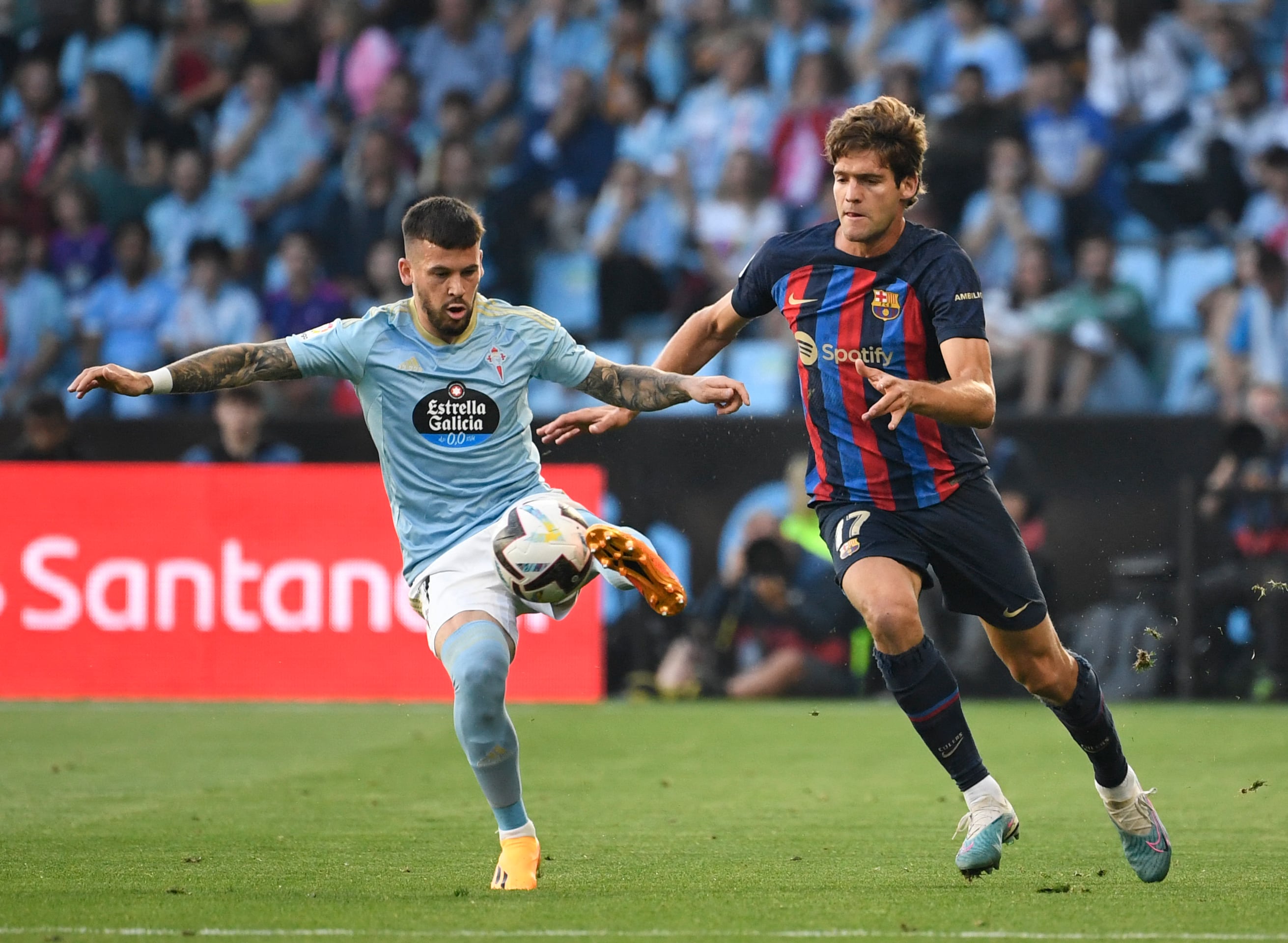 Celta Vigo&#039;s Spanish forward Carles Perez (L) vies with Barcelona&#039;s Spanish defender Marcos Alonso during the Spanish league football match between RC Celta de Vigo and FC Barcelona at the Balaidos stadium in Vigo on June 4, 2023. (Photo by MIGUEL RIOPA / AFP) (Photo by MIGUEL RIOPA/AFP via Getty Images)