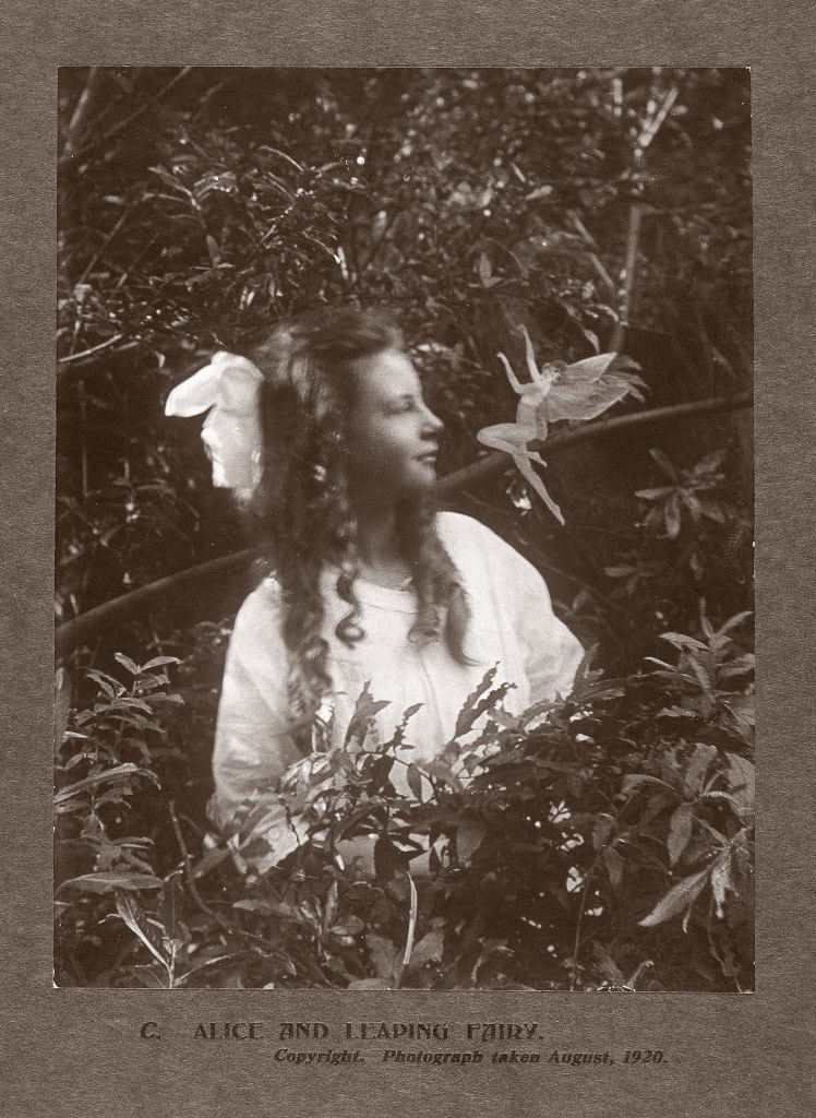 UNITED KINGDOM - OCTOBER 08:  In the summer of 1917, 15-year-old Elsie 'Iris' Wright (1901-1988) and her 10-year-old cousin Frances 'Alice' Griffiths (1907-1996) claimed to have photographed fairies in a beck behind Elsie's home in Cottingley, near Bradford. The photographs of the 'Beck Fairies', as the girls called them, went on to become one of the most famous examples of image manipulation in photography. Alice was probably the name given to Frances by Sir Arthur Conan Doyle (1859-1930) in an attempt to conceal the girls' identities when he published the photographs. Although Elsie later admitted the photographs were fakes, Frances was more reticent. To her dying day she claimed that the girls had seen fairies, and that at least one of the photographs was genuine.  (Photo by SSPL/Getty Images)