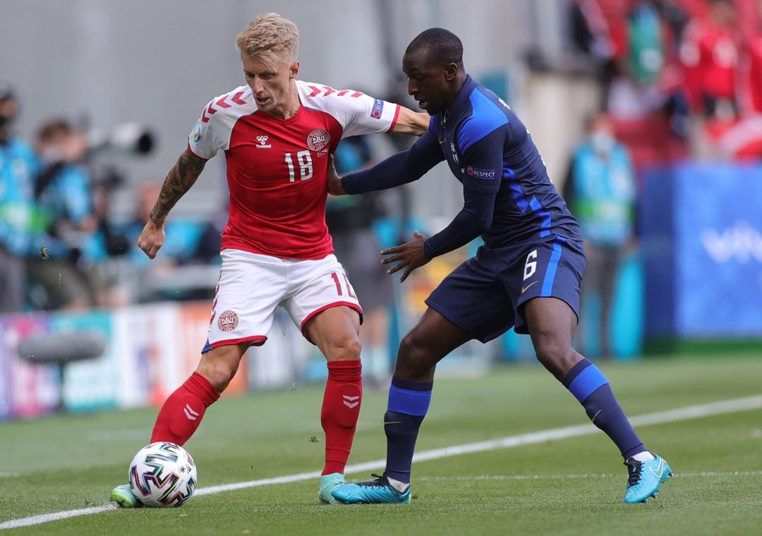 Daniel Wass of Denmark battles for possession with Glen Kamara of Finland during the UEFA Euro 2020