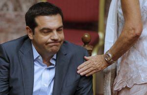 Greek Prime Minister Alexis Tsipras reacts as he attends a parliamentary session in Athens, Greece, August 14, 2015. Tsipras confronted a widening rebellion within his leftist Syriza party as parliament voted to approve the country&#039;s third financial rescu