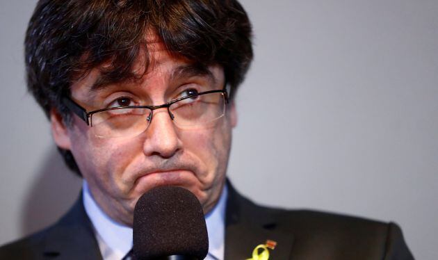 Carles Puigdemont reacts during a news conference in Berlin,