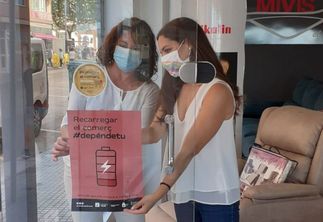 Campaña de cheques Compte amb tu en la ciudad de Oliva