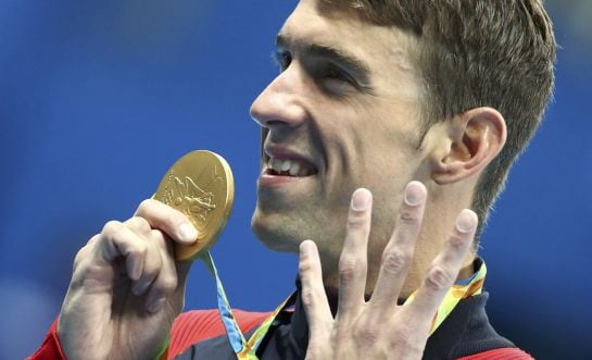 2016 Rio Olympics - Swimming - Victory Ceremony - Men&#039;s 200m Individual Medley Victory Ceremony - Olympic Aquatics Stadium - Rio de Janeiro, Brazil - 11/08/2016. Michael Phelps (USA) of USA poses with his gold medal. REUTERS/Michael Dalder FOR EDITORIAL U