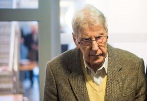 Former Auschwitz guard Reinhold Hanning arrives for his trial at the court in Detmold, western Germany, on February 11, 2016.  The 94-year-old former Auschwitz guard went on trial for complicity in the murders of tens of thousands of people at the Nazi co