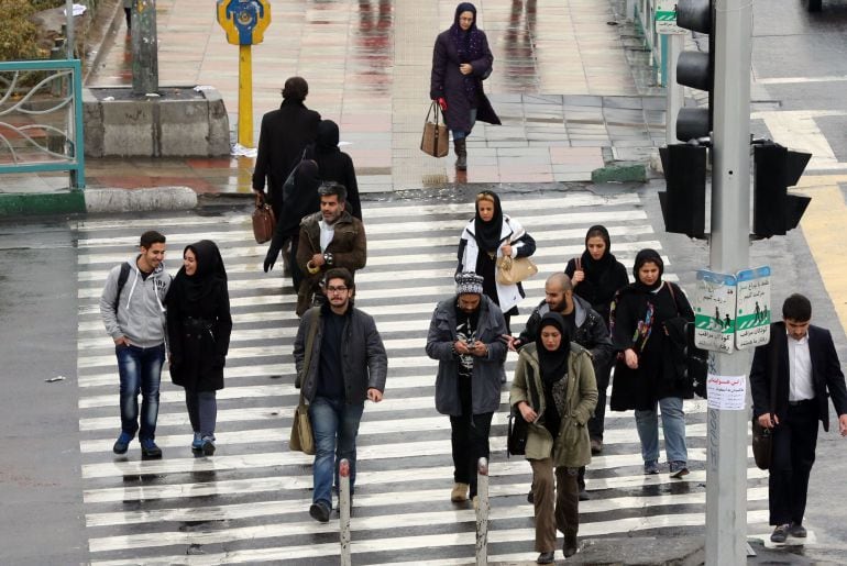 Iranians walk on a street in the capital Tehran on November 25, 2014. Supreme leader Ayatollah Ali Khamenei said that Iran would not sink &quot;to its knees&quot; over its disputed nuclear programme, his first comment since a missed deadline for a deal. Iran and wo