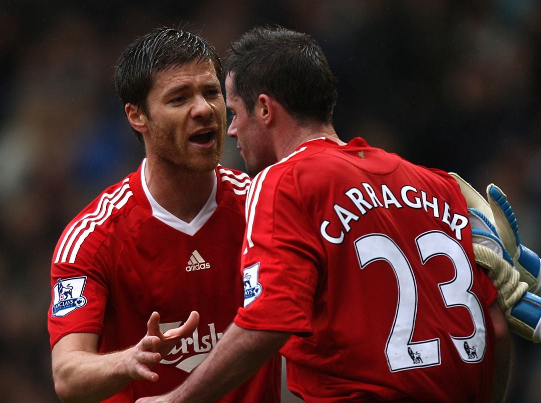 Xabi Alonso y Jamie Carragher