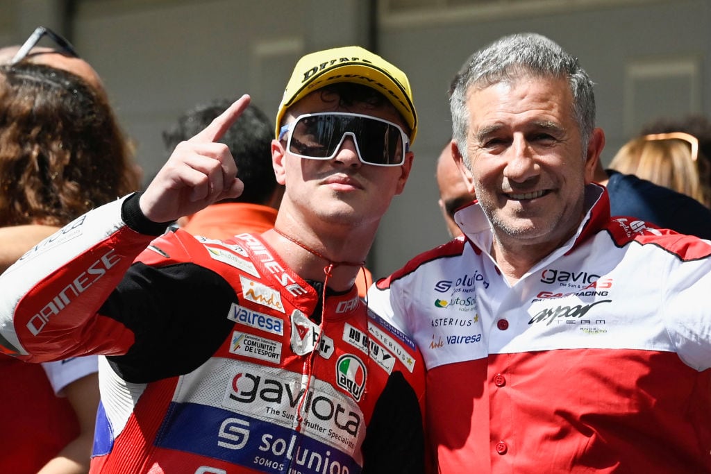 Izan Guevara of Spain and GASGAS Aspar and Jorge Aspar Martinez of Spain celebrate under the podium during the Moto3 race during the MotoGP of Catalunya - Race at Circuit de Barcelona-Catalunya on June 05, 2022 in Barcelona, Spain. (Photo by Mirco Lazzari gp/Getty Images)