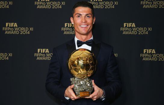 ZURICH, SWITZERLAND - JANUARY 12: FIFA Ballon d&#039;Or winner Cristiano Ronaldo of Portugal and Real Madrid poses with his award during the FIFA Ballon d&#039;Or Gala 2014 at the Kongresshaus on January 12, 2015 in Zurich, Switzerland. (Photo by Alexander Hassenst