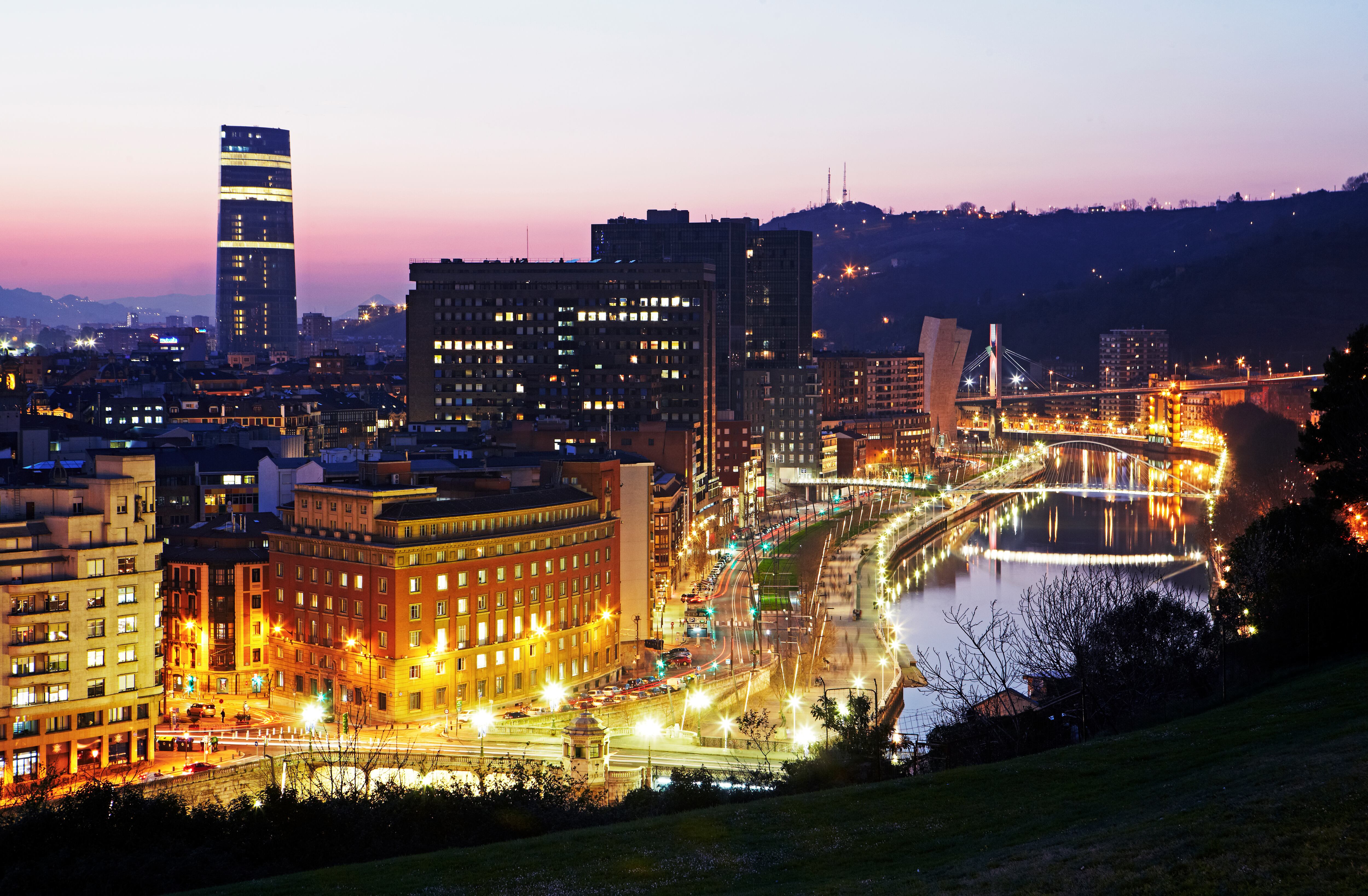 View of Downtown Bilbao at sunset from Extebarria Parkea