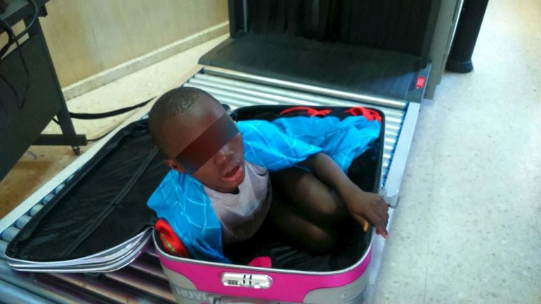 ATTENTION EDITORS: SPANISH LAW REQUIRES THAT THE FACES OF MINORS ARE MASKED IN PUBLICATIONS WITHIN SPAIN   An eight-year-old boy is seen cramped inside a suitcase on a Spanish civil guard  border security check point between Morocco and Spain&#039;s north afri