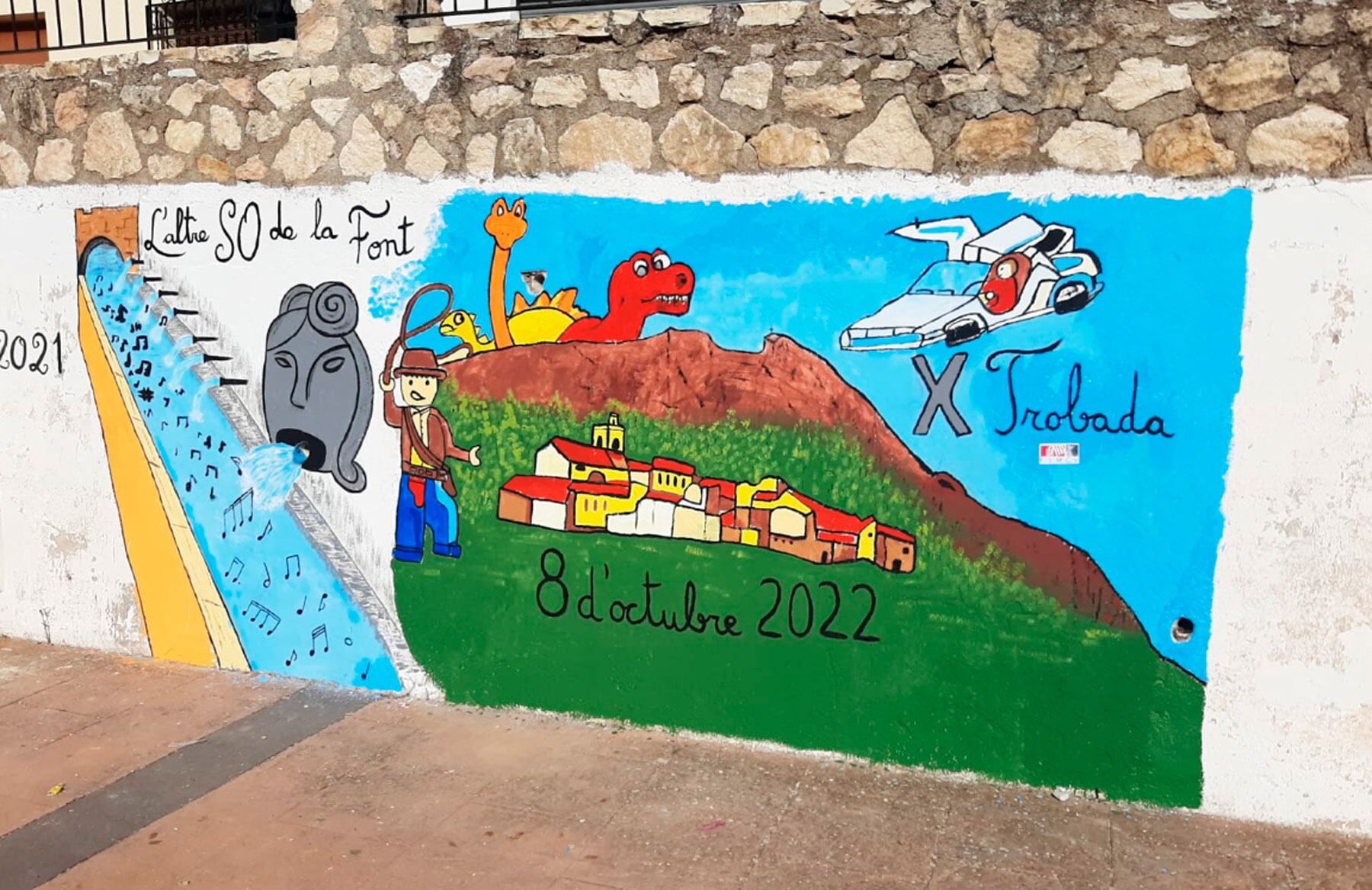 Dins de les activitats es va pintar un mural en el patí de les antigues escoles