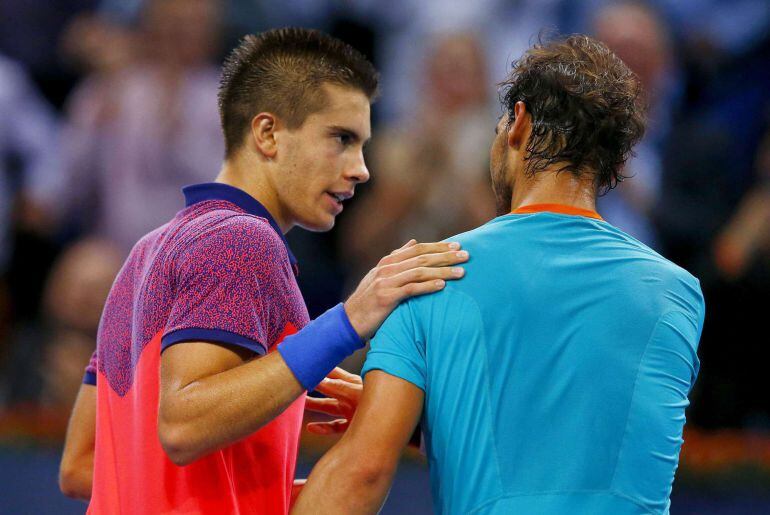 Borna Coric of Croatia is congratulated by Spain's Rafael Nadal (R) after winning at the Swiss Indoors ATP tennis tournament in Basel October 24, 2014.   REUTERS/Arnd Wiegmann (SWITZERLAND - Tags: SPORT TENNIS)