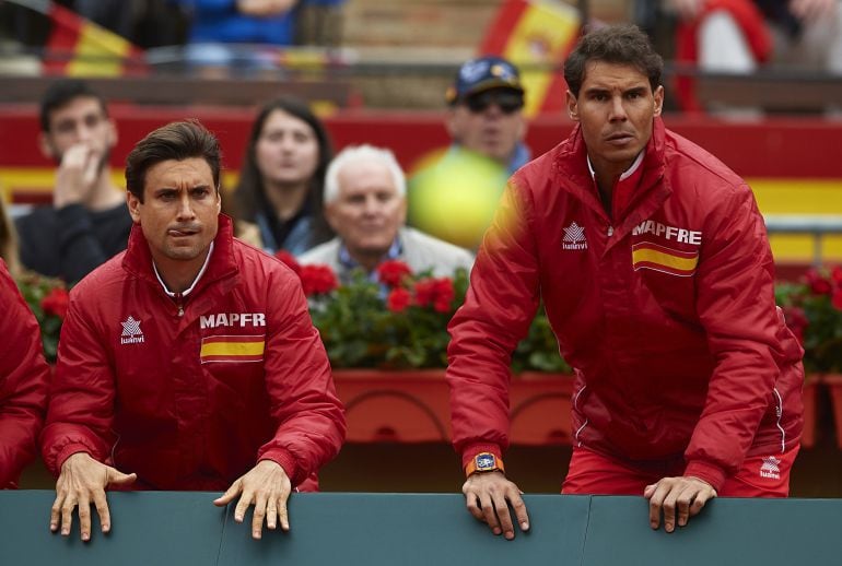 David Ferrer (L) and Rafael Nadal of Spain react for Feliciano Lopez and Marc Lopez of Spain in action againist Tim Puetz and Jan-Lennard Struff of Germany in the doubles during day two of the Davis Cup World Group Quarter Final match between Spain and Ge