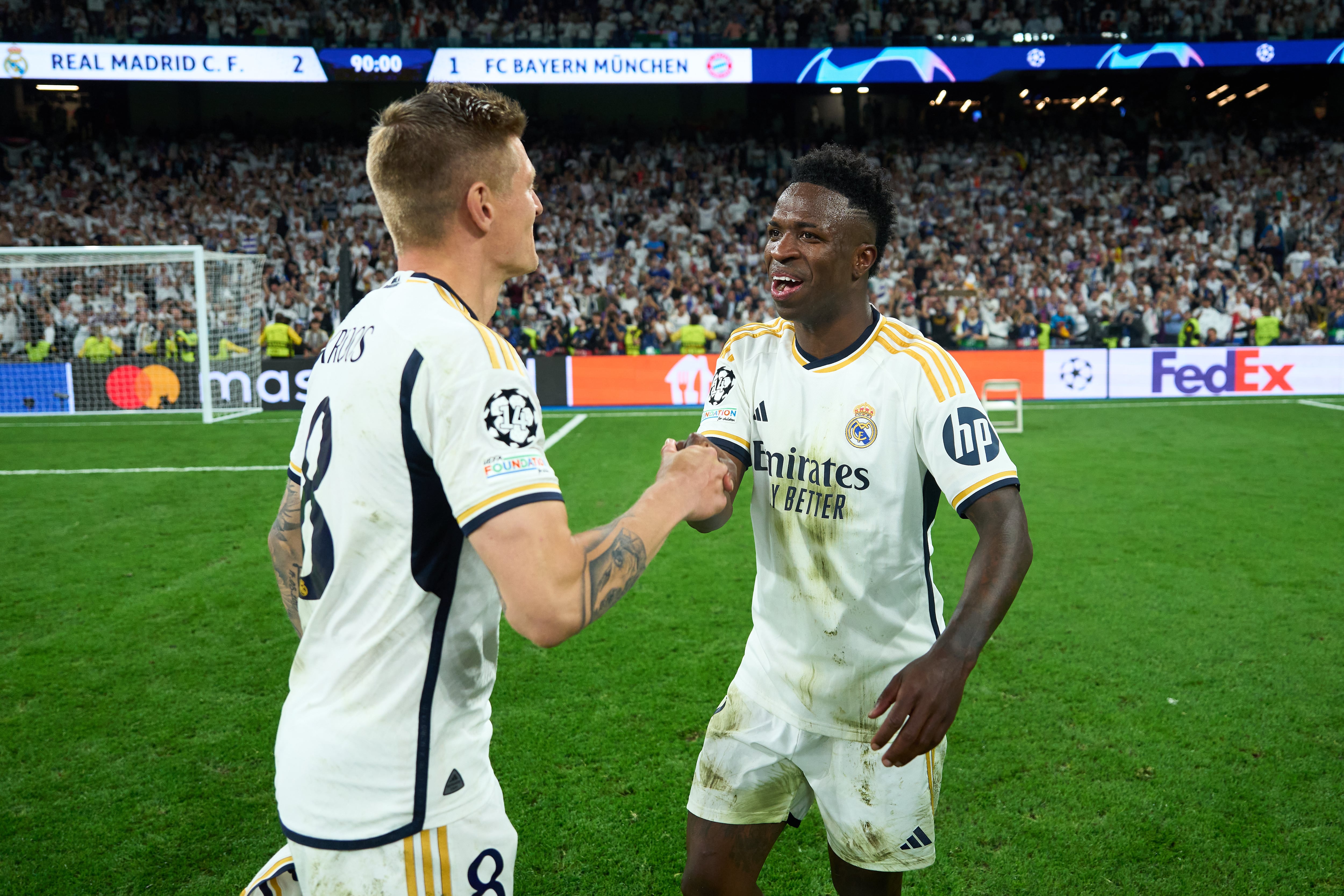 Kroos y Vinicius durante un partido de Champions League
