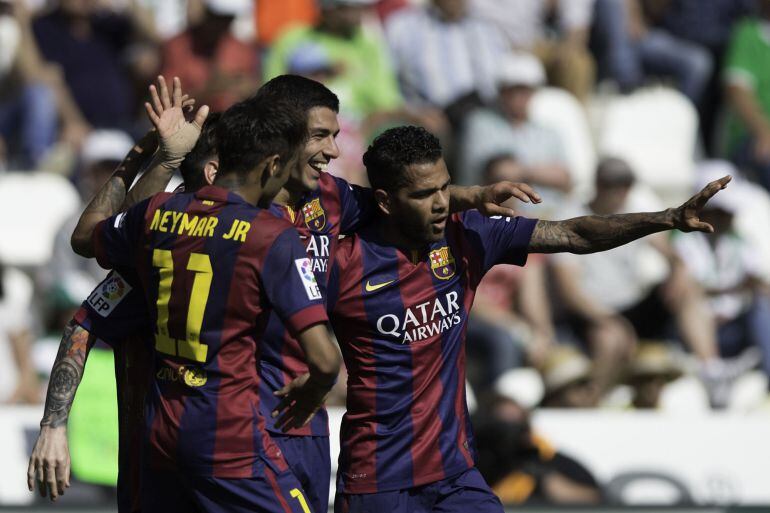 CORDOBA, SPAIN - MAY 02:  Luis Suarez (2ndL) of FC Barcelona celebrates scoring their eight goal with teammates Neymar JR. (L) and Dani Alves(R) during the La Liga match between Cordoba CF and Barcelona FC at El Arcangel stadium on May 2, 2015 in Cordoba,