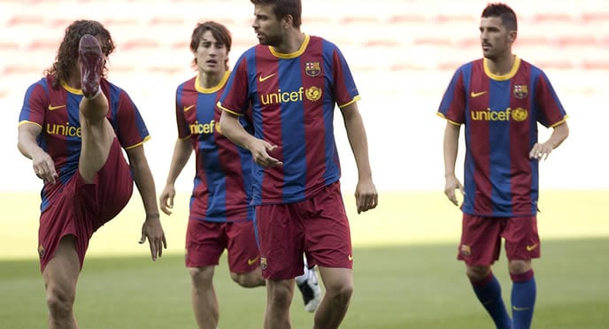 Piqué, Villa, Puyol y Bojan, durante un entrenamiento del Barça