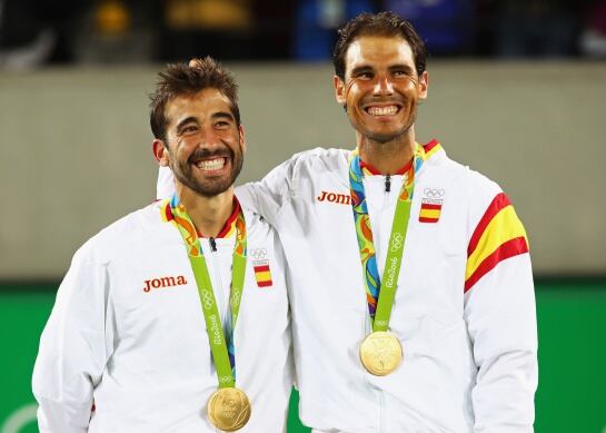 RIO DE JANEIRO, BRAZIL - AUGUST 12: (L-R) Gold medalists Rafael Nadal and Marc Lopez of Spain celebrate on the podium after the Men&#039;s Doubles competition on Day 7 of the Rio 2016 Olympic Games at the Olympic Tennis Centre on August 12, 2016 in Rio de Jane